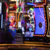 In this Aug. 27, 2020, file photo, a woman wearing a mask as a precaution against the coronavirus plays an electronic slot machine during the reopening of the Mirage hotel and casino in Las Vegas.