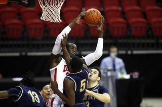 UNLV Rebels forward Cheikh Mbacke Diong (34) pulls down a rebound during the Rebels' season opener against Montana State at the Thomas & Mack Center Wednesday, Nov. 25, 2020.