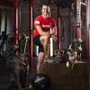 Nick McCombs, President of Branded One Cross Fit, poses for a photo with his dogs Skyla, left, and Bowie in his gym, Tuesday, Nov. 24, 2020.