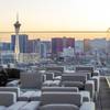 Strip casinos are viewed at sunset from the outdoor patio of the Legacy Club, a rooftop lounge, at Circa in downtown Las Vegas Tuesday, Dec. 22, 2020.