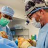 From left, Surgical Technologist Bryan Bernard assists Dr. Lane Smith, of Smith Plastic Surgery, during a breast augmentation at the Surgical Institute of Las Vegas Monday, Dec. 21, 2020.