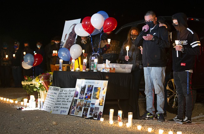 Christopher Meneses speaks during a vigil for his uncle Eric Echevarria on Fort Apache Road near Blue Diamond Road Sunday, Jan. 3, 2021. Eric Echevarria, 52, was killed in a traffic accident on Fort Apache Wednesday. Zaon Collins, 19, a UNLV basketball recruit, is facing charges relating to the accident.