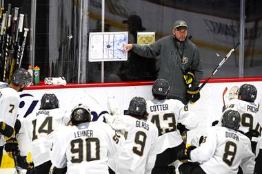 Vegas Golden Knights players listen to head coach Peter DeBoer during training camp at City National Arena Wednesday, Jan. 6, 2021.