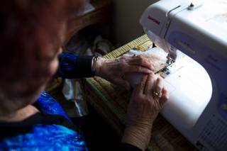 Sharon Royer, 77, sews a face mask in her home, Wednesday, Jan. 6, 2021. Royer has made and donated over 7,050 masks.