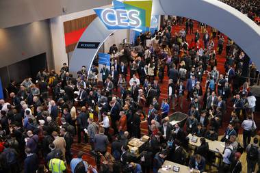 In this Jan. 7, 2020, file photo, crowds enter the convention center on the first day of the CES tech show, in Las Vegas.
