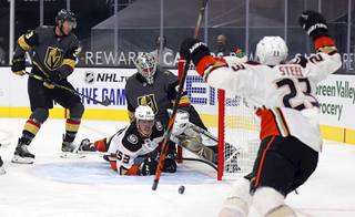 Anaheim Ducks left wing Max Comtois (53) looks up at center Sam Steel (23) after scoring against the Vegas Golden Knights during the first period of an NHL hockey game Thursday, Jan. 14, 2021, in Las Vegas.
