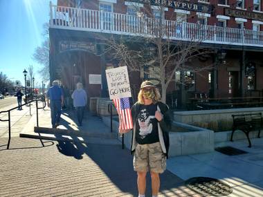 Unidentified woman shows up to the Nevada State Capitol complex to counter-protest a rumored pro-Trump demonstration that didn’t happen Sunday, Jan. 17, 2021.
