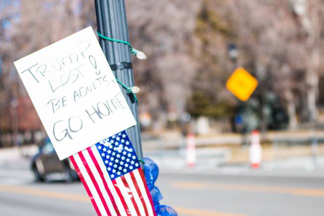 A sign left behind by a counter-protester who showed up to a rumored national pro-Trump demonstration, which didn't happen Sunday, Jan. 17, 2021.
