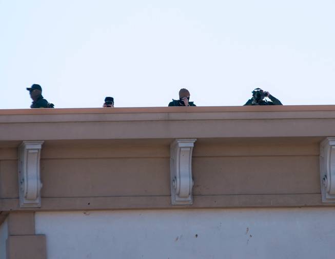 Lookout officers atop of a building in downtown Carson CIty in preparation for a national protest that didn't materialize Sunday, Jan. 17, 2021.
