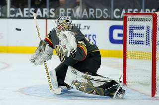 Vegas Golden Knights goaltender Robin Lehner (90) attempts to block a shot by the Arizona Coyotes during the first period of an NHL hockey game Monday, Jan. 18, 2021, in Las Vegas.