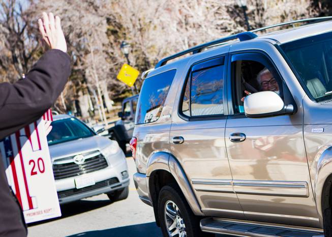 Motorists honk and wave at protesters who gathered near the Nevada Capitol complex in downtown Carson City to protest President Joe Biden's inauguration Wednesday, Jan. 20, 2021.