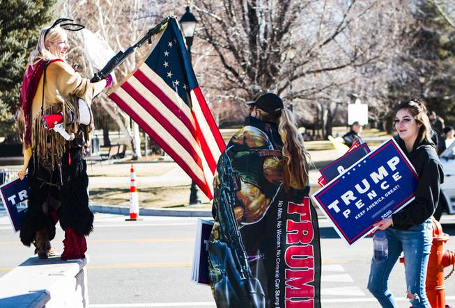 Protesters gather near the Nevada Capitol building in downtown Carson City to protest President Joe Biden's inauguration Wednesday, Jan. 20, 2021.