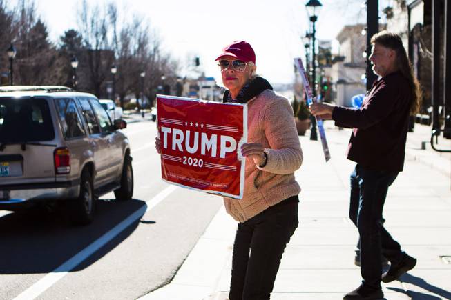 Two Donald Trump supporters show up to a protest near the Nevada Capitol complex refuting President Joe Biden's presidency Wednesday, Jan. 20, 2021.