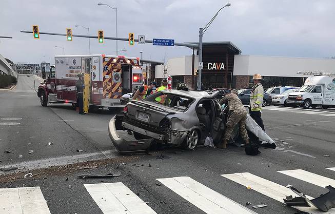 Medics and military personnel respond to a crash scene in Tysons, Virginia, on Jan. 18, 2021. Two Nevada National Guard troops, Capt. Tana Gurule and Capt. Tyler Wistisen, both from the Guard's 1-221st Cavalry, and National Guard 1st Lt. Michael Flury, are being lauded for saving a woman's life.