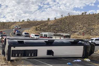 This photo shows a Las Vegas-based tour that rolled over in northwestern Arizona on Friday, Jan. 22, 2021. One person died and two were critically injured. The cause of the rollover is under investigation. 