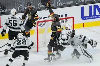 Vegas Golden Knights right wing Mark Stone (61) celebrates after scoring against Los Angeles Kings goaltender Jonathan Quick (32) during the first period of an NHL hockey game Friday, Feb. 5, 2021, in Las Vegas.