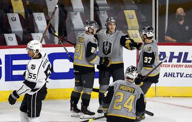 Henderson Silver Knights’ Danny O’Regan (21), Peyton Krebs (18), Reid Duke (37) and Ryan Murphy (24) celebrate after O’Regan’s goal in the third period of the Silver Knights’ season opener against the Ontario Reign at the Orleans Arena Saturday, Feb. 6, 2021.