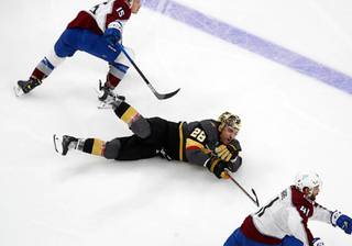 Vegas Golden Knights left wing William Carrier (28) hits the ice after being tripped up in the third period of a game against the Colorado Avalanche at T-Mobile Arena Tuesday, Feb. 16, 2021.