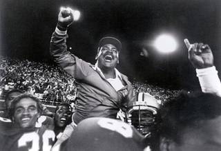 An undated file photos shows Wayne Nunnely celebrating a victory. Nunnely, the only UNLV football player to also become head coach of the Rebels, has passed away at the age of 68.