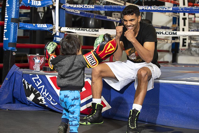 Super lightweight boxer Joey Borrero, 23, plays with his son ...