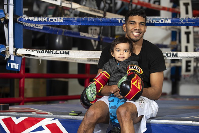 Super lightweight boxer Joey Borrero, 23, poses with his son ...