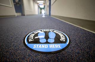 A social distancing marker is shown in a hallway at Goolsby Elementary School Tuesday, Feb. 23, 2021.