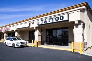 An exterior view of the Black Omen Tattoo shop in Las Vegas Tuesday, Feb. 23, 2021. Anyone who buys a print or original work of art from Black Omen Tattoo can get a raffle ticket for a chance to become its new owner.