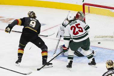 Vegas Golden Knights center Cody Glass (9) scores against Minnesota Wild goaltender Cam Talbot (33) during an NHL hockey game at T-Mobile Arena, Monday, March 1, 2021.