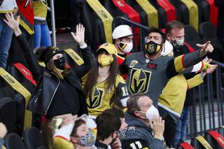 Vegas Golden Knights fans celebrate a goal against Minnesota Wild during an NHL hockey game at T-Mobile Arena, Monday, March 1, 2021.