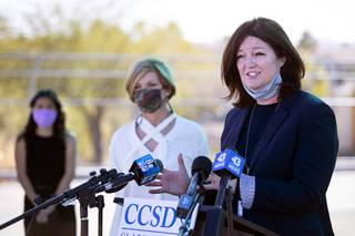 CCSD Deputy Superintendent Brenda Larsen-Mitchell responds to a question during a news conference at Wolff Elementary School in Henderson Friday, March 5, 2021. Listening in the background are school principal Linnea Westwood, left, and Congresswoman Susie Lee, D-Nev.