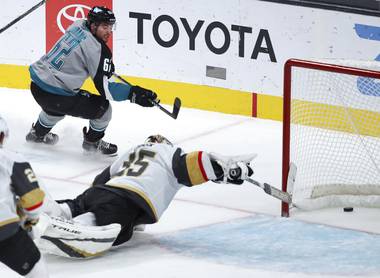 San Jose Sharks right wing Kevin Labanc (62) scores a goal against Vegas Golden Knights goaltender Oscar Dansk (35) during the third period of an NHL hockey game in San Jose, Calif., Friday, March 5, 2021. 