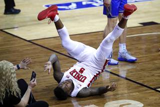 UNLV Rebels guard David Jenkins Jr. (5) falls to the court after being fouled fouled in a game against the Air Force Falcons during the Air Force Reserve Mountain West Basketball Championships at the Thomas & Mack Center Wednesday, March 10, 2021.