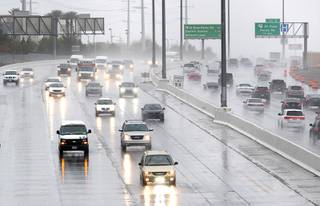 The morning commute is slowed by rain on the I-215 beltway in Henderson Friday, March 12, 2021.