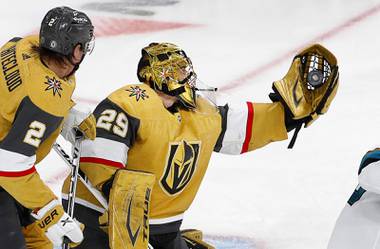 Vegas Golden Knights goaltender Marc-Andre Fleury (29) makes a glove save in the second period of a game against the San Jose Sharks at T-Mobile Arena Wednesday, March 17, 2021. Vegas Golden Knights defenseman Zach Whitecloud (2) is at left. 