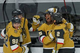 Vegas Golden Knights forward Keegan Kolesar (55) celebrates with his team after scoring his first goal in the NHL against St. Louis in the third period at T-Mobile Arena, Monday, March 22, 2021. The Golden Knights won Blues 5-1.