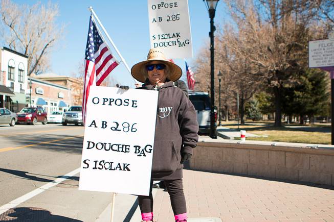 during a pro-gun protest at the Nevada State Capitol complex in Carson City Saturday, March 27, 2021. The protesters are opposed gun control legislation, including AB 286, which would ban ghost guns, or firearms without serial numbers, which are often built at home. About 100 people attended the rally.