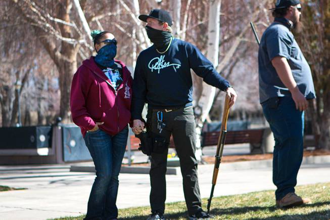 People attend during a pro-gun rally at the Nevada State Capitol complex in Carson City Saturday, March 27, 2021. The protesters are opposed gun control legislation, including AB 286, which would ban ghost guns, or firearms without serial numbers, which are often built at home. About 100 people attended the rally.