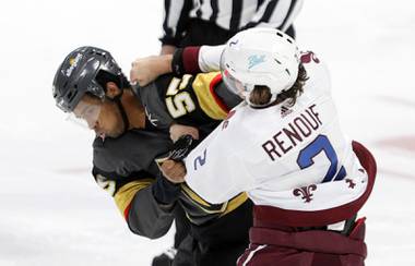 Vegas Golden Knights right wing Keegan Kolesar (55) fights Colorado Avalanche defenseman Dan Renouf (2) during the first period of an NHL hockey game in Denver, Saturday, March 27, 2021.