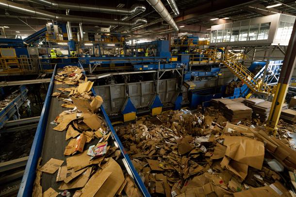 A conveyor belt moves cardboard at the Republic Services of Southern Nevada Recycling Center in North Las Vegas, Friday, March 26, 2021.