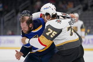 St. Louis Blues' Kyle Clifford, left, and Vegas Golden Knights' Ryan Reaves (75) fight during the first period of an NHL hockey game Wednesday, April 7, 2021, in St. Louis.