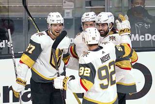 Vegas Golden Knights right wing Alex Tuch (89) celebrates with team mates after he scored a goal during the first period of an NHL hockey game against the Los Angeles Kings Wednesday, April 14, 2021, in Los Angeles.