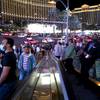 Tourists ride escalators to Planet Hollywood and the Miracle Mile Shops on the Las Vegas Strip Saturday, April 17, 2021.