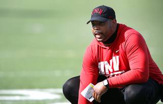 Larry Grant, a former NFL player and UNLV football's new defensive analyst, calls out to players during practice at Rebel Field Tuesday, April 20, 2021. Grant was a linebacker playing for various NFL teams from 2008 to 2014.