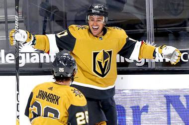 Vegas Golden Knights center Jonathan Marchessault (81) celebrates with Mattias Janmark (26) after scoring in the third period of a game against the San Jose Sharks at T-Mobile Arena Wednesday, April 21, 2021. 