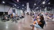 Visitors to the COVID-19 vaccine clinic at the Las Vegas Convention Center might find themselves tapping their toes and nodding their heads in the post-shot observation area. Thanks to a grant and a desire to brighten necessary but spartan spaces ...