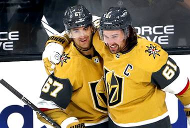 Vegas Golden Knights left wing Max Pacioretty (67) celebrates with right wing Mark Stone (61) after scoring in the second period of a game against the Colorado Avalanche at T-Mobile Arena Wednesday, April 28, 2021.