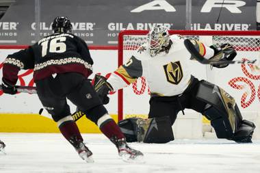 Vegas Golden Knights goaltender Robin Lehner, right, makes a save on a shot from Arizona Coyotes center Derick Brassard (16) during the second period of an NHL hockey game Friday, April 30, 2021, in Glendale, Ariz. (AP Photo/Ross D. Franklin)