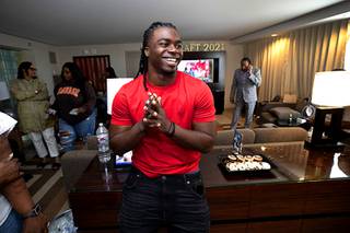 Rhamondre Stevenson, a Centennial High School graduate and Las Vegas Sun player of the Year in 2015, smiles in a suite at Aria, after being drafted by the New England Patriots in the fourth round Saturday, May 1, 2021.