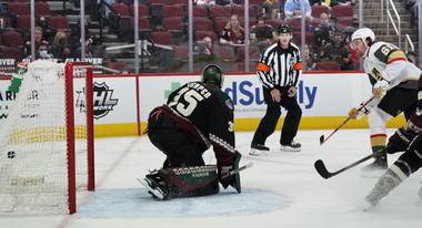 Vegas Golden Knights right wing Mark Stone (61) scores a goal against Arizona Coyotes goaltender Darcy Kuemper (35) during the second period of an NHL hockey game Saturday, May 1, 2021, in Glendale, Ariz. (AP Photo/Ross D. Franklin)