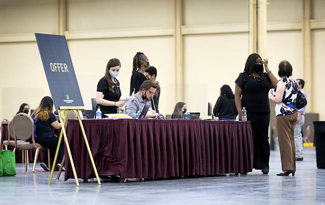 A check-in desk for job offers is shown during an MGM Resorts hiring fair at the Mandalay Bay Convention Center Tuesday, May 4, 2021.